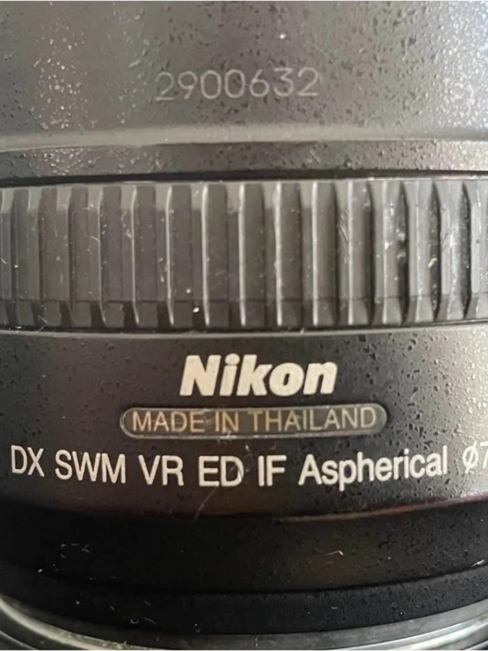 Nikon Black DSLR with Telephoto Zoom and Lens Hood